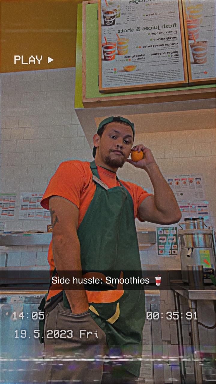 Coach Cal at the Palo Alto Farmer's Market with a green Organic Blendz smoothie — Bay Area rapper-chef Smoothie Rap apron