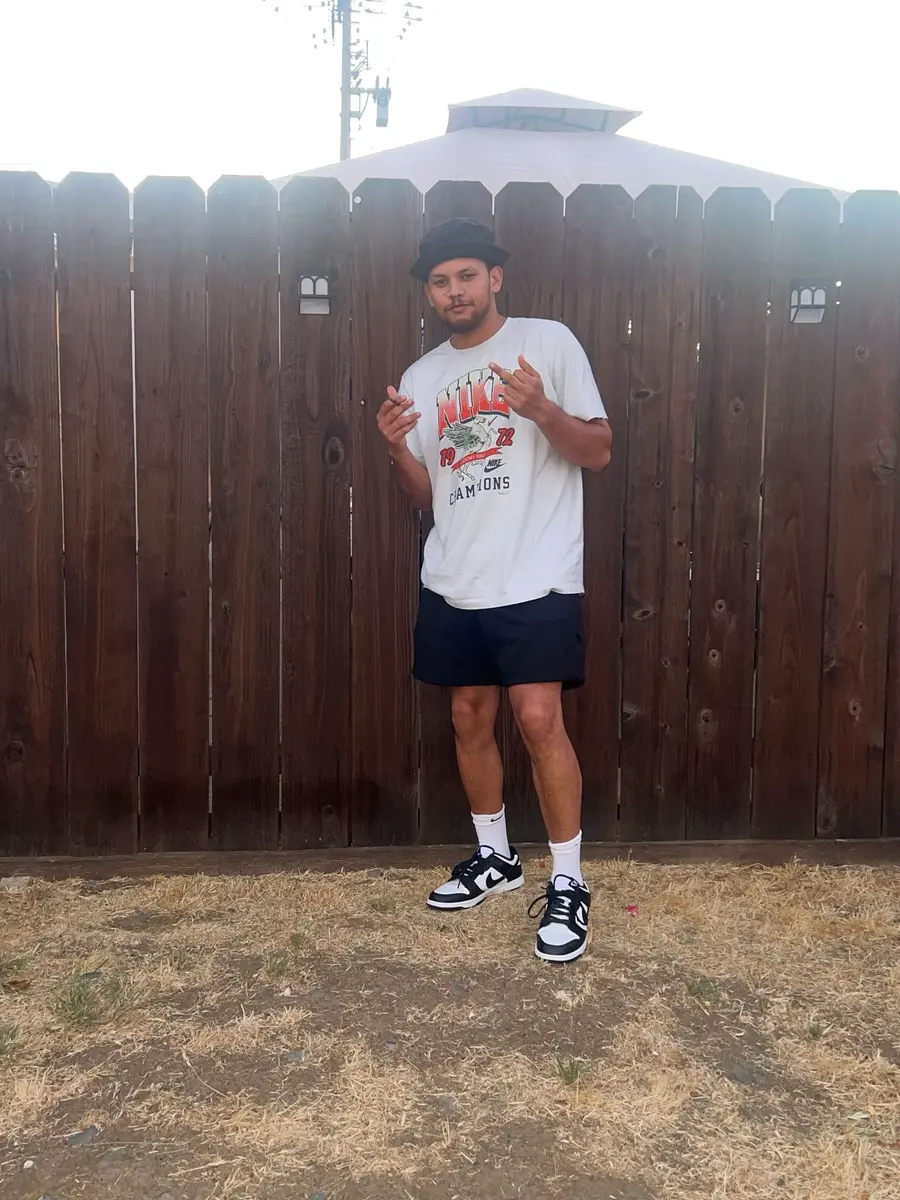 Coach Cal full-length portrait — Bay Area fit, vintage 49ers Nike tee and Dunk Lows